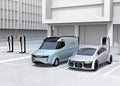 Electric delivery minivan and silver sedan charging at charging station