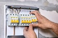 Electric distribution board consumer unit with fuse box or circuit breaker, electrical work to install new panel. Royalty Free Stock Photo