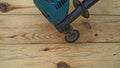 Electric drill with attachment to emphasize the texture of wood. carpentry