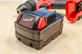 Electric drill or cordless screwdriver with battery, recharge battery.