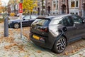 Electric drive car charging on street in Amsterdam, The Netherlands.