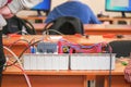 Electric educational device white color with the wires on table Royalty Free Stock Photo