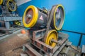 Electric elevator motor in motion in the technical room of the elevator