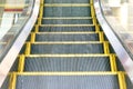 Electric Escalator. Close up - floor platform - yellow bands. gray metal steel line. Way up Royalty Free Stock Photo