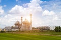 Electric factory power plant and electrical substation on a cloud sky background