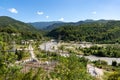 Electric field high voltage transformer with lines and poles in mountains Royalty Free Stock Photo