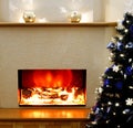 Electric fireplace with the Christmas tree Royalty Free Stock Photo