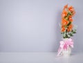 Electric flower in vase on table Royalty Free Stock Photo