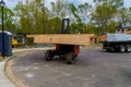 Electric forklift in loading framing beams palette