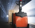 Electric Forklift Pallet Jack with Package Boxes at The Warehouse. Shipping Warehouse Logistics Royalty Free Stock Photo