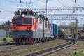 Electric freight locomotive VL80s with a train departs from the station