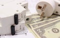 Electric fuse and plug, money on electrical drawing, energy concept Royalty Free Stock Photo