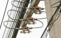 Electric fuses and cables on the arm of pole