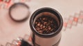 Electric grinder full of coffee beans. The morning drink that wakes you up Royalty Free Stock Photo