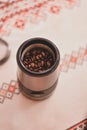 Electric grinder full of coffee beans. The morning drink that wakes you up Royalty Free Stock Photo