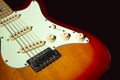 Electric guitar on a black background, isolated on a dark background in close-up. Selective focus Royalty Free Stock Photo