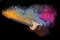 Electric guitar with colorful smoke on black background, stylish design. Rock music concept Royalty Free Stock Photo