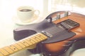 Electric guitar and a cup of coffee.