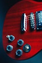 Red electric guitar with festive Christmas lights