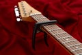 Electric guitar fretboard with capodaster, closeup Royalty Free Stock Photo