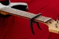 Electric guitar fretboard with capodaster, closeup Royalty Free Stock Photo