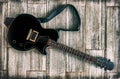 Electric guitar grunge look studio shot up view on wooden background Royalty Free Stock Photo