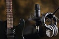 Electric guitar, microphone and earphones Royalty Free Stock Photo