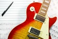 Electric guitar with music notes in the background. Royalty Free Stock Photo