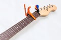 Electric guitar neck with a capo Royalty Free Stock Photo