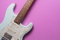Electric guitar on pink table background, close up music concept Royalty Free Stock Photo