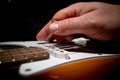 electric guitar is played with a red pick Royalty Free Stock Photo