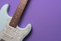 Electric guitar on purple table background Royalty Free Stock Photo