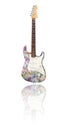 Electric guitar with reflection covered with euros Royalty Free Stock Photo