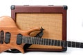 An electric guitar and a vintage looking combo amp shot against a white background Royalty Free Stock Photo
