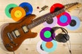 Electric guitar, 33 and 45 vinyl records, and headphones Royalty Free Stock Photo