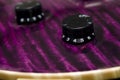 Electric guitar volume and tone control dials Royalty Free Stock Photo