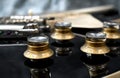 Electric guitar volume and tone knobs Royalty Free Stock Photo