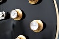 Electric guitar volume and tone knobs Royalty Free Stock Photo