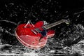Electric guitar in water Royalty Free Stock Photo