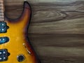 Electric guitar with wooden background.