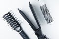 Electric hair straightener brush roll and comb.