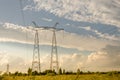 Electric high voltage tower/Power line post against the blue sky Royalty Free Stock Photo