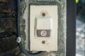 Electric House Gate Buzzer button on concrete wall