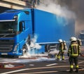 electric hybrid cargo courier semi truck burning, firefighter apply foam extinguish flames big smoke