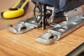 Electric jigsaw sawed easily laminated panel Royalty Free Stock Photo