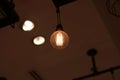 A electric lamp lighting . modern and vintage style , interior ceiling hanging light bulb decorate at room Royalty Free Stock Photo