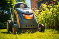 electric lawn mower charging in a sunny garden