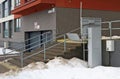 Electric lift for disabled people installed near the stairs of a residential building