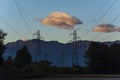 Electric lines at dusk with mountains in background Royalty Free Stock Photo