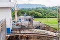 Electric locomotives, known as mules, guiding a container ship through Gatun Locks, part of Panama Cana Royalty Free Stock Photo